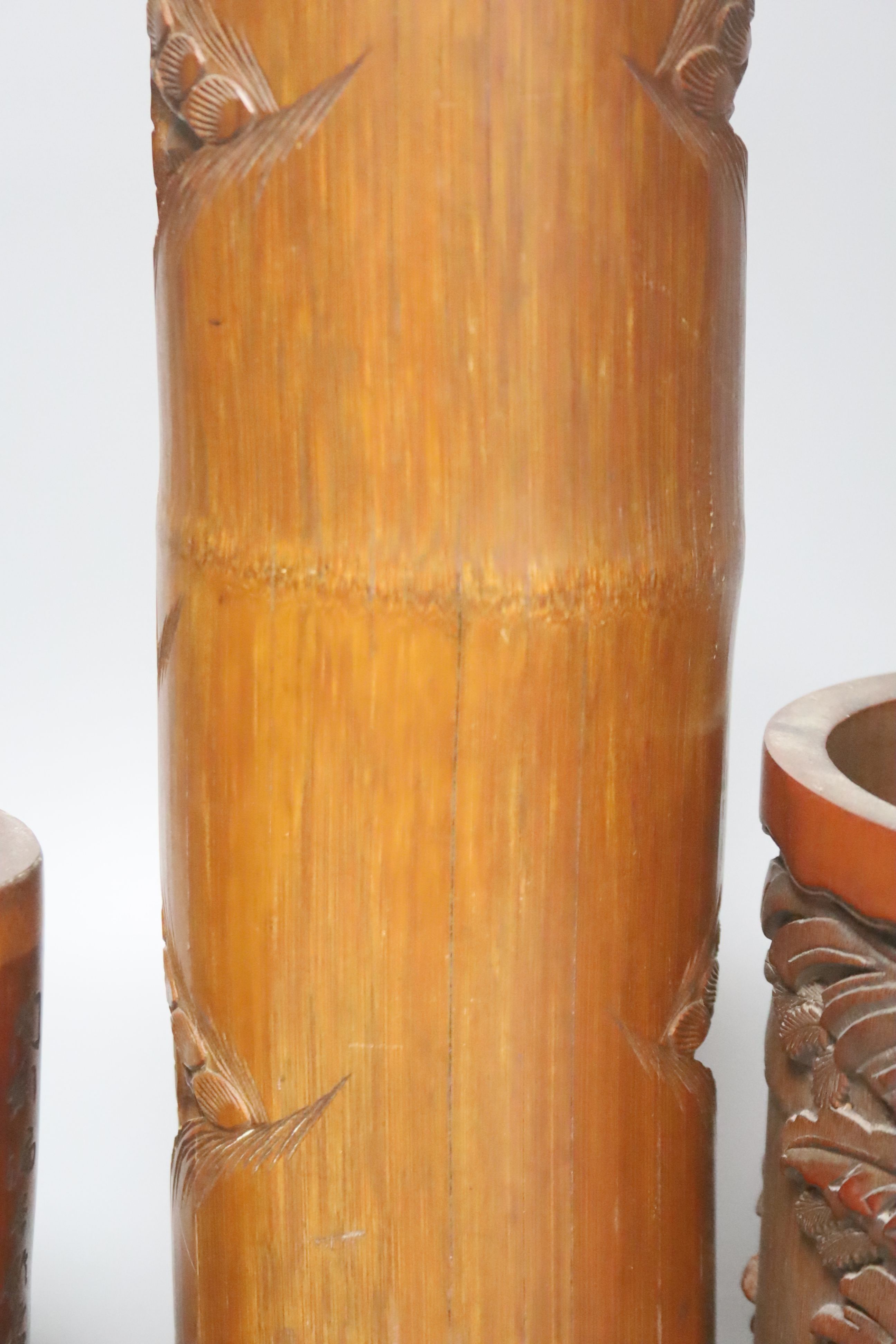 Four Chinese wood and bamboo brush pots, tallest 32cm